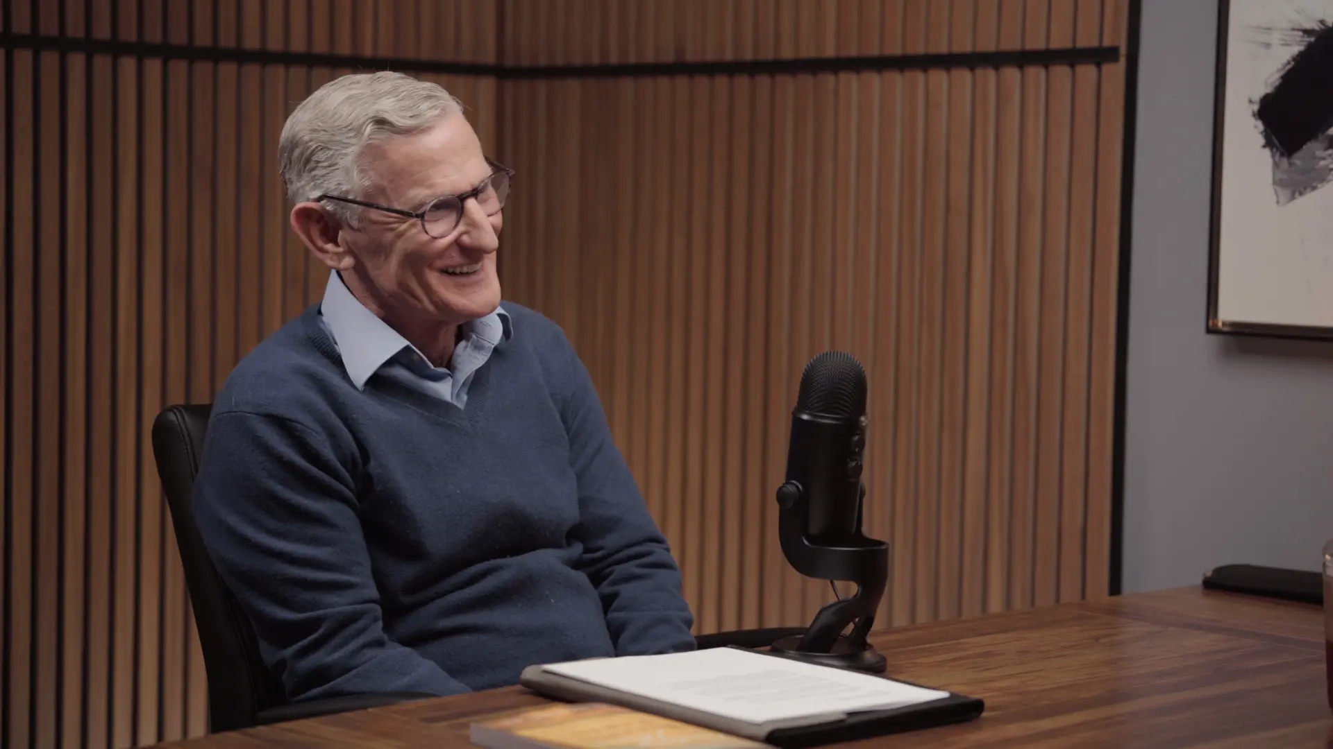 Client smiling during podcast recording